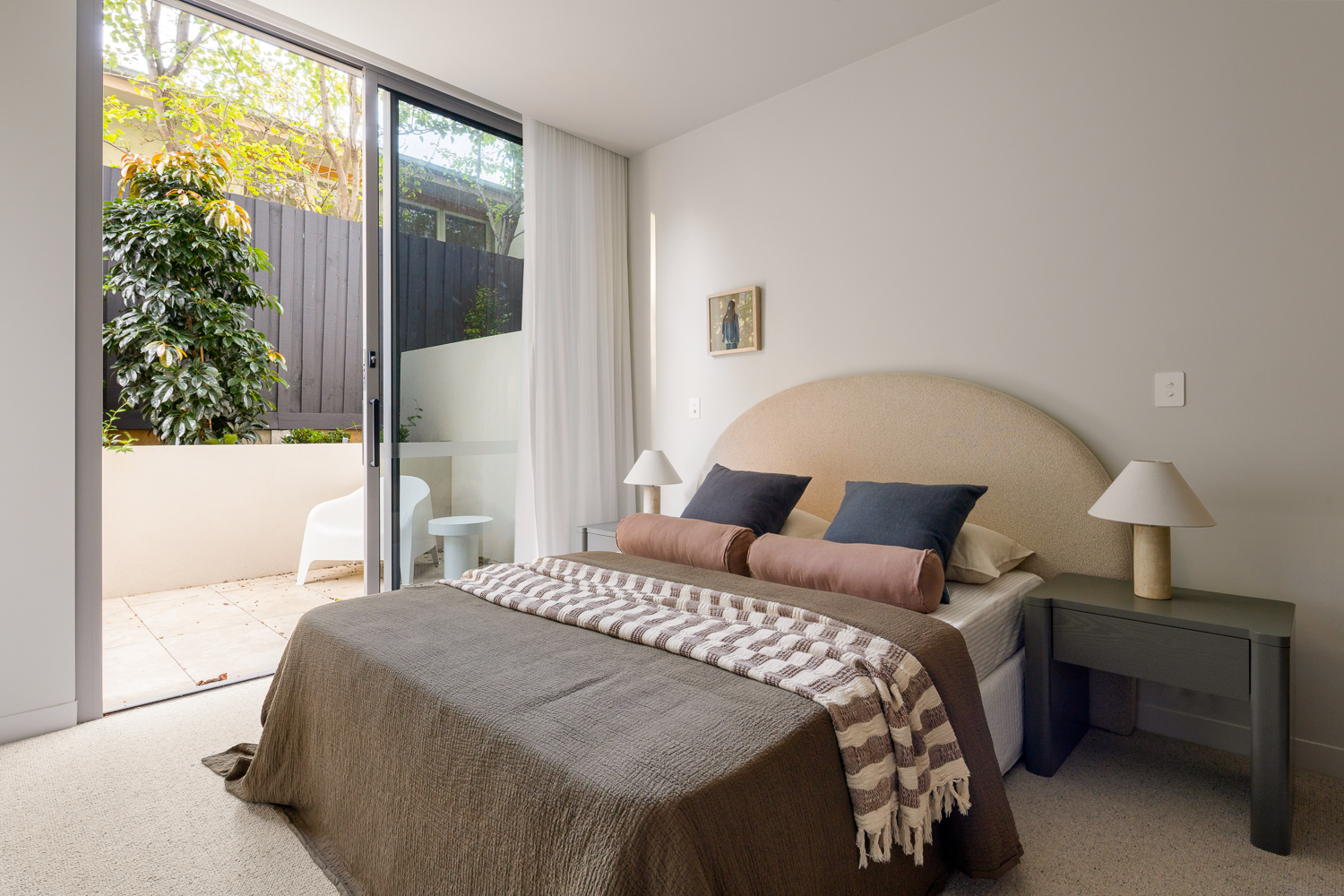 Residence bedroom opening to a private courtyard